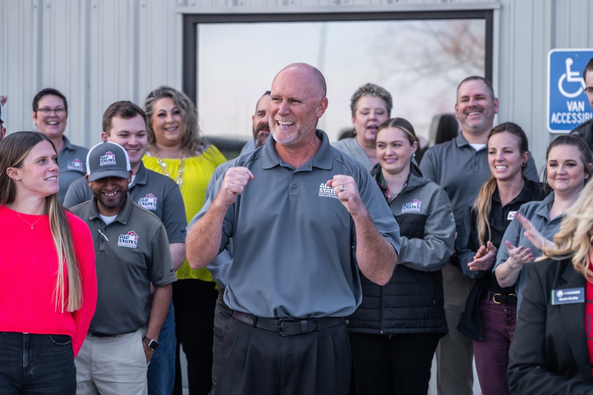 All States Home Improvement team celebrating together in company apparel