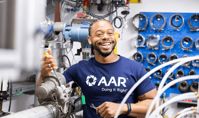 AAR component repair employee at work in branded apparel