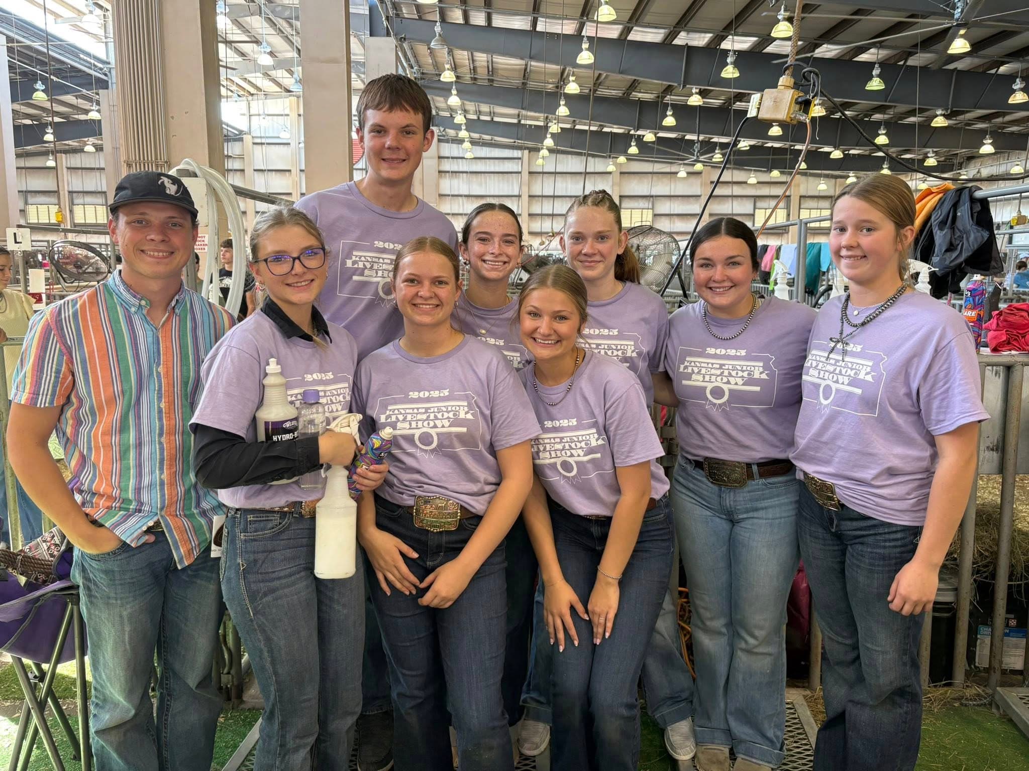KJLS team members in coordinated branded apparel