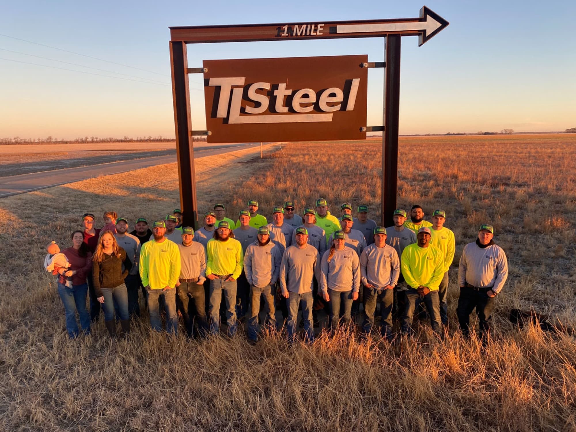 TL Steel crew together in branded apparel