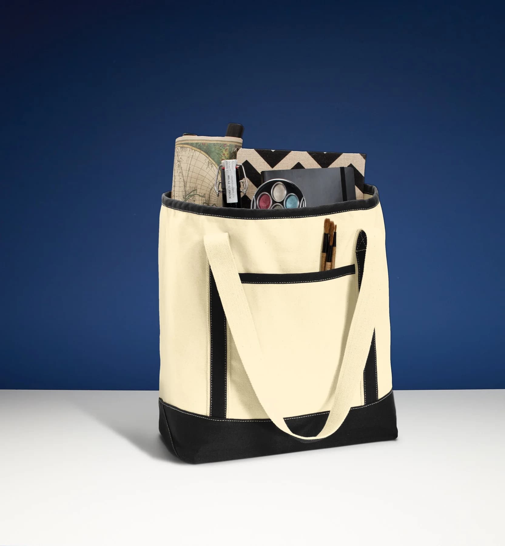 Natural canvas tote styled against a navy background