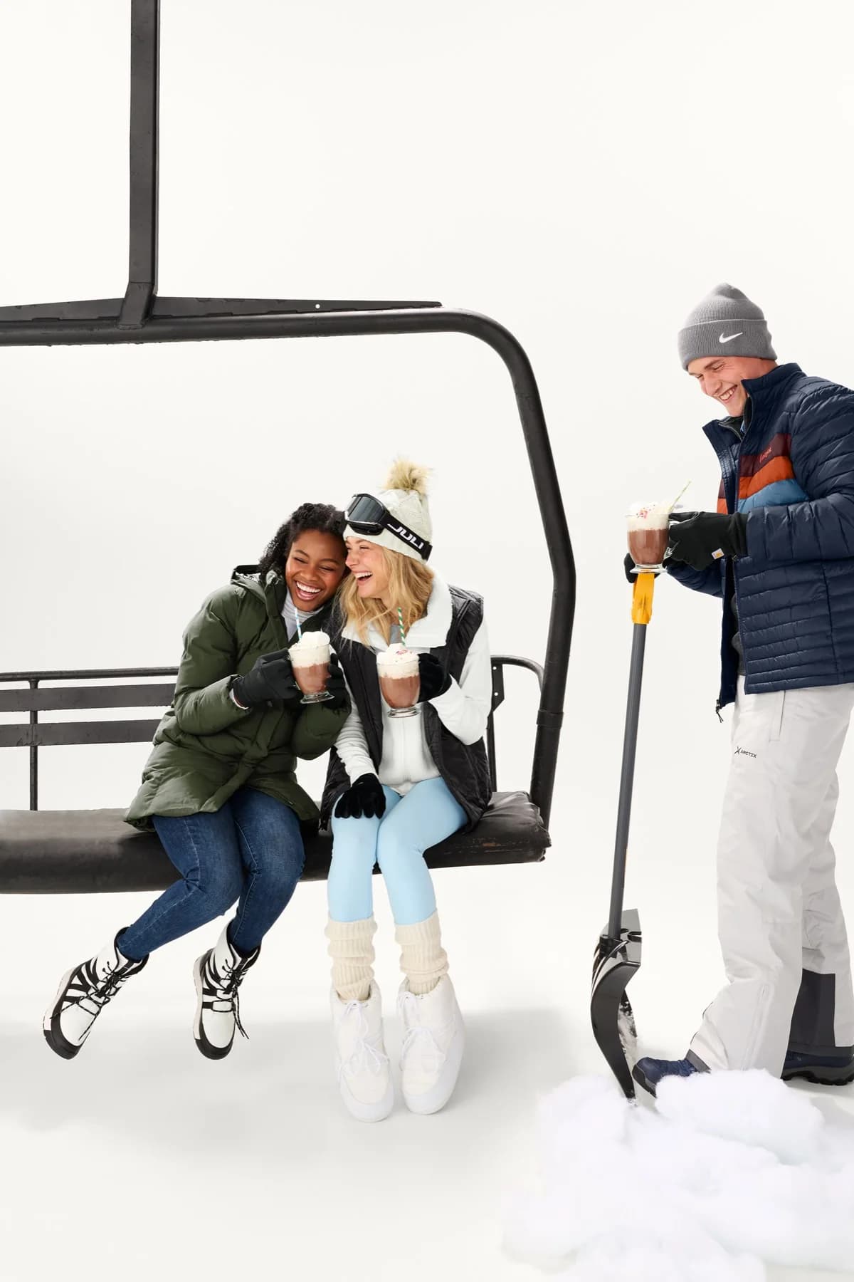 Friends wearing The North Face outerwear at a snowy ski lift