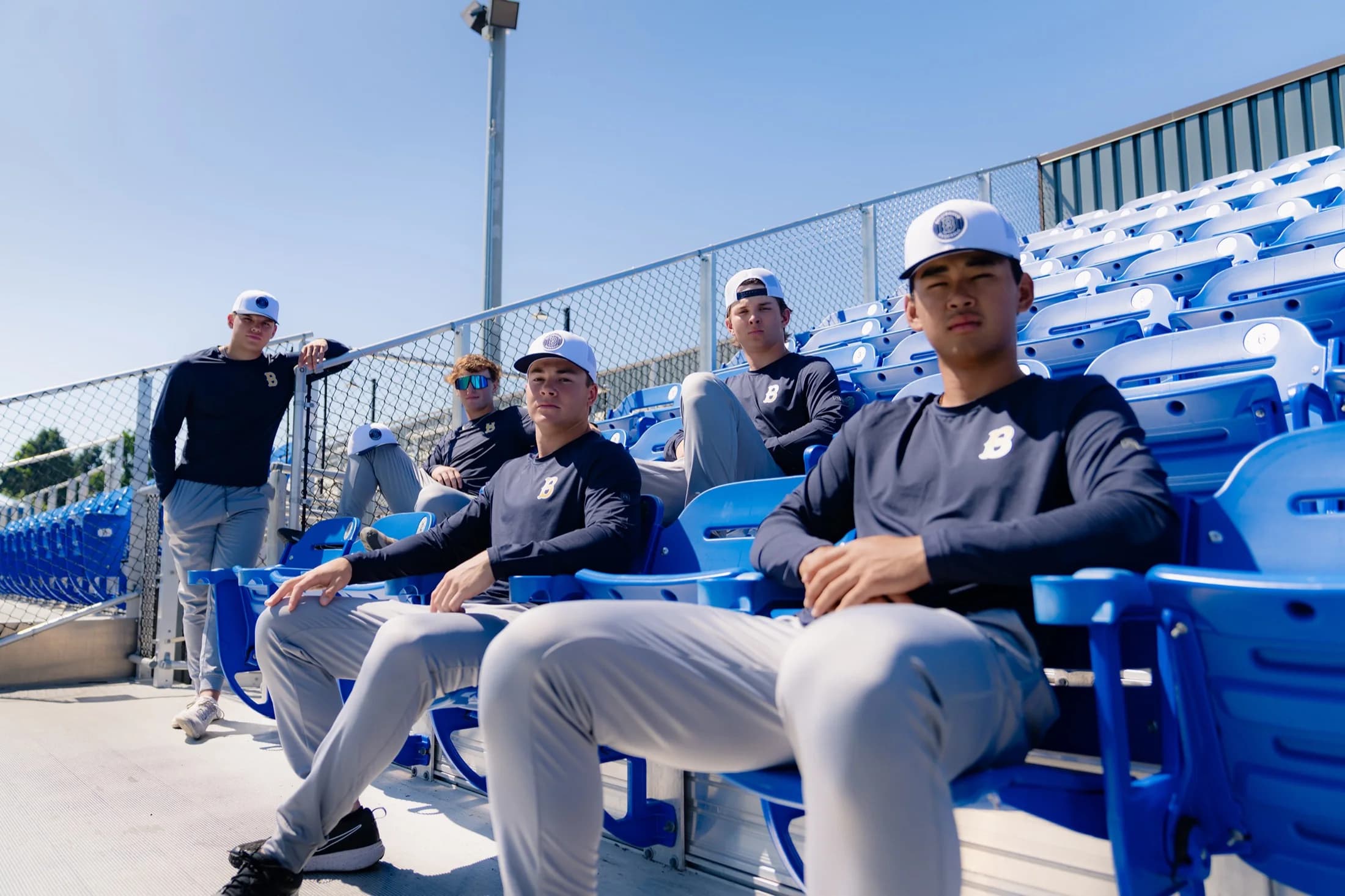 Baseball team wearing Richardson caps in stadium seating